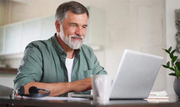 Request Credentials Image of man with computer